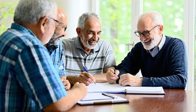 Seniors and veterans reviewing life insurance options with a Trusted Path Agency advisor